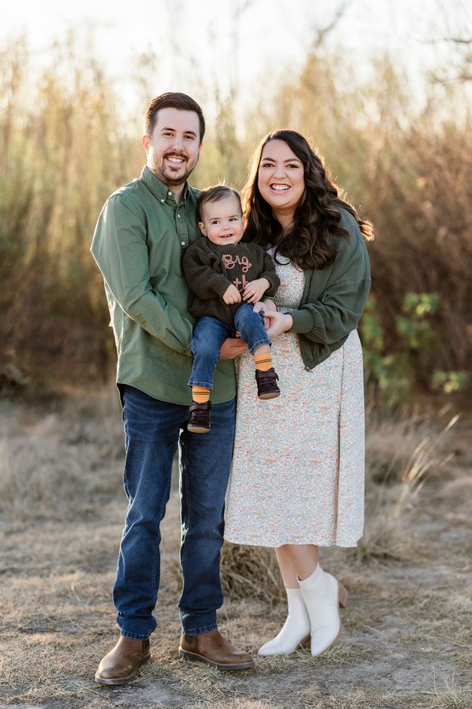 Family photography with parents and big brother. Baby announcement by newborn photographer in Midland TX
